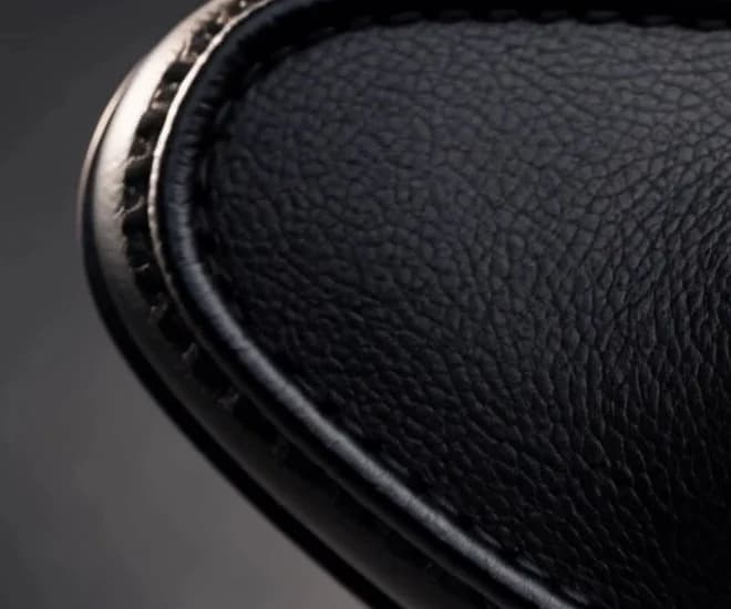 Close-up of the pebbled black leather and stitching at the toe